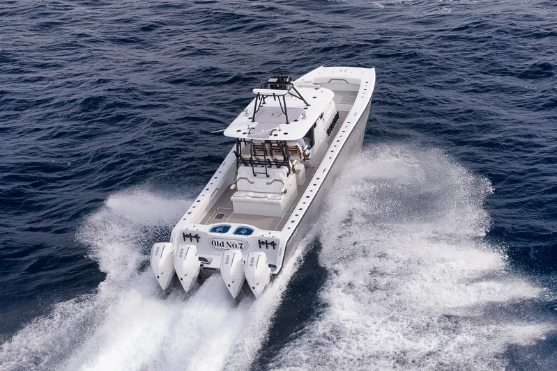  Yacht Photos Pics 2022 Freeman 42LR boat cruising on open ocean with powerful engines.