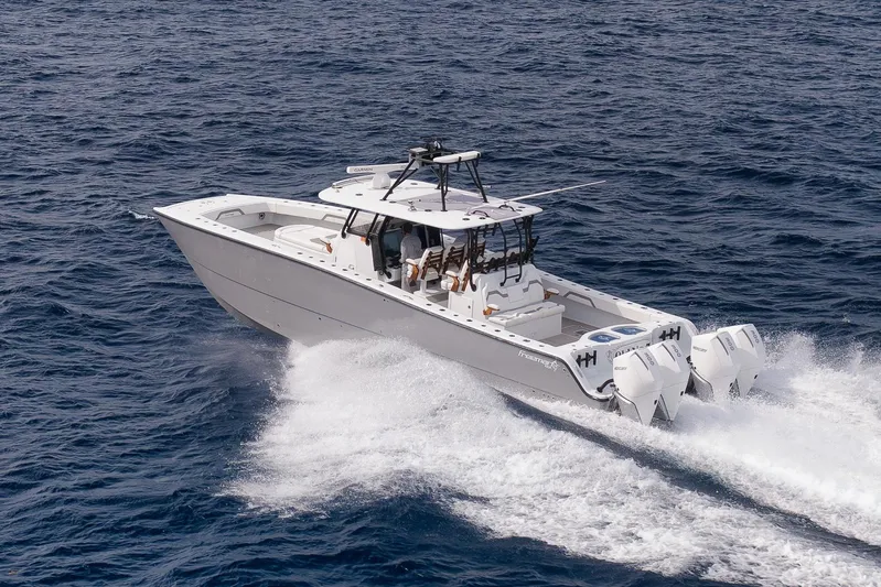  Yacht Photos Pics 2022 Freeman 42LR boat cruising on open ocean waters.