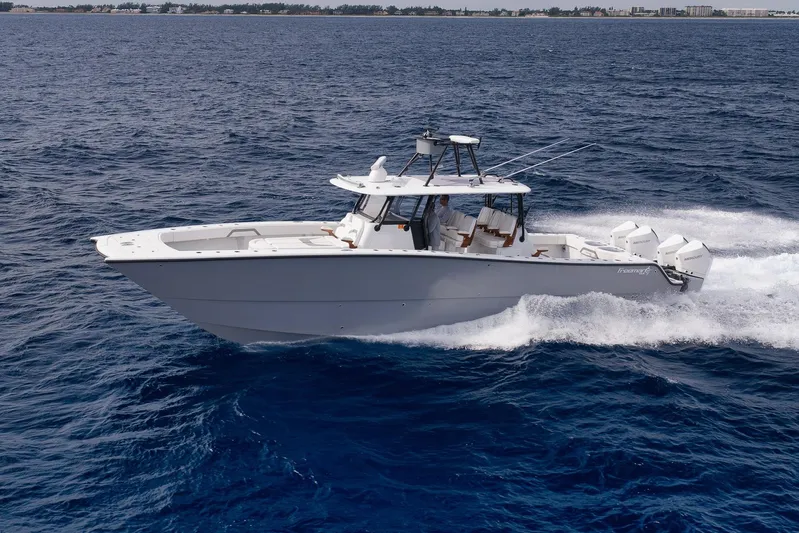  Yacht Photos Pics 2022 Freeman 42LR boat cruising on open ocean waters.