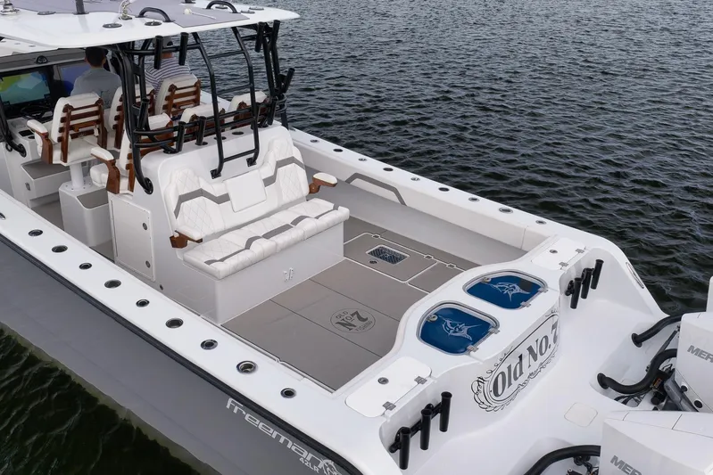  Yacht Photos Pics 2022 Freeman 42LR boat with spacious deck and seating on water.