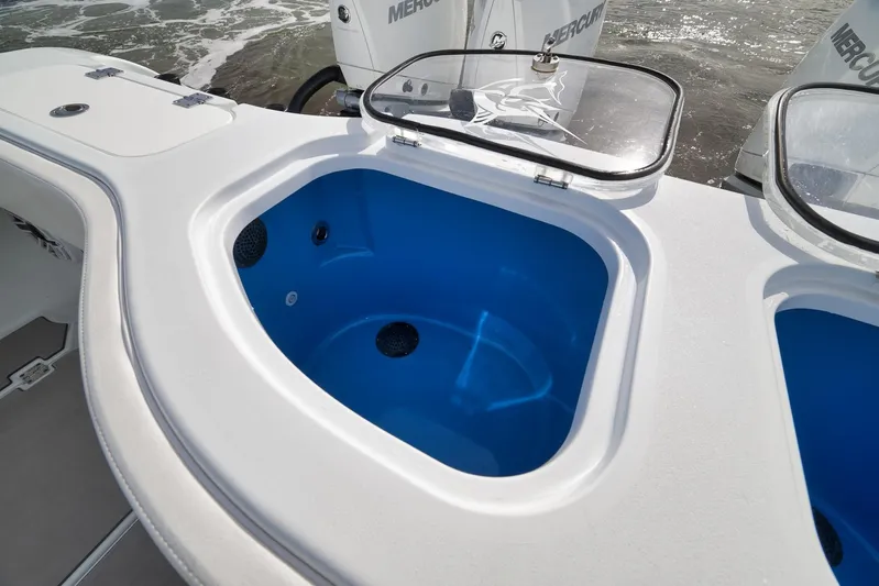  Yacht Photos Pics Livewell on a 2022 Freeman 42LR boat, featuring a blue interior and clear lid.