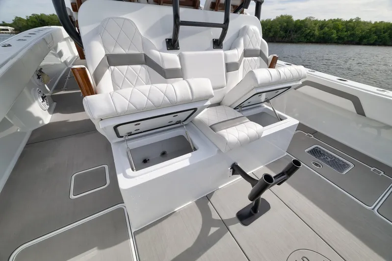  Yacht Photos Pics Luxurious seating and storage on 2022 Freeman 42LR boat, featuring sleek design and functionality.