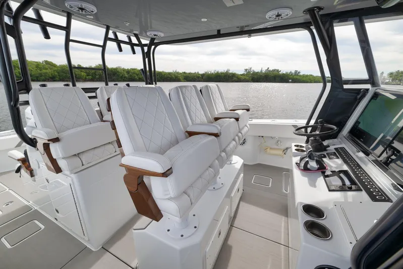  Yacht Photos Pics Interior of 2022 Freeman 42LR boat with luxurious seating and advanced navigation system.