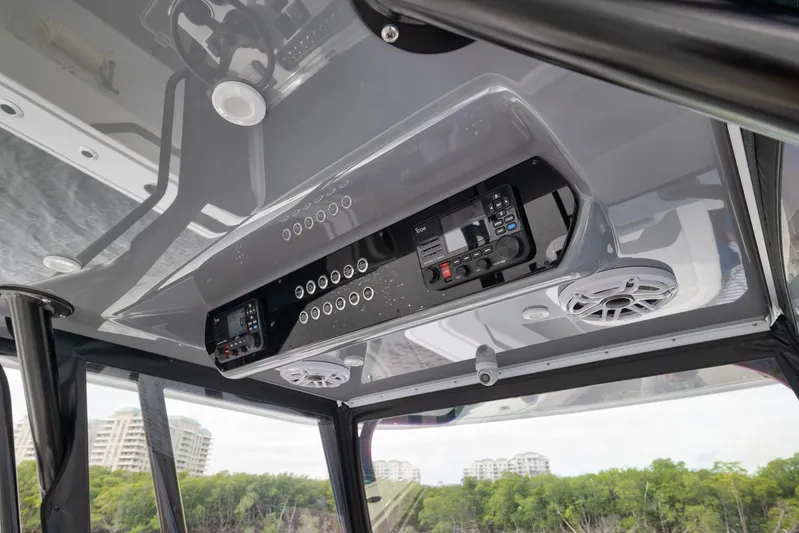  Yacht Photos Pics Overhead console of 2022 Freeman 42LR boat with controls and speakers.