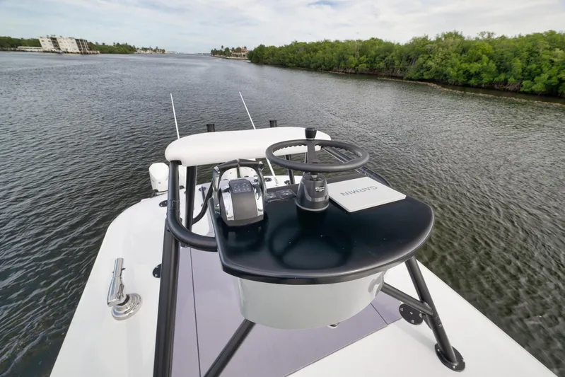  Yacht Photos Pics 2022 Freeman 42LR boat helm with Garmin navigation, cruising on a scenic waterway.