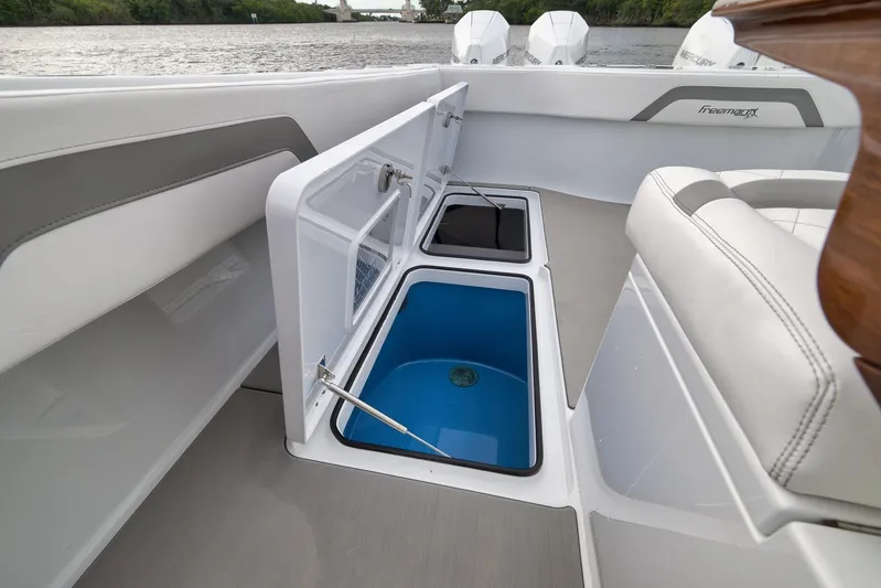  Yacht Photos Pics 2022 Freeman 42LR boat interior with open storage compartments and seating.