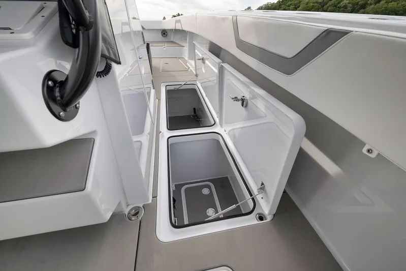  Yacht Photos Pics 2022 Freeman 42LR boat interior with open storage compartments, showcasing sleek design.