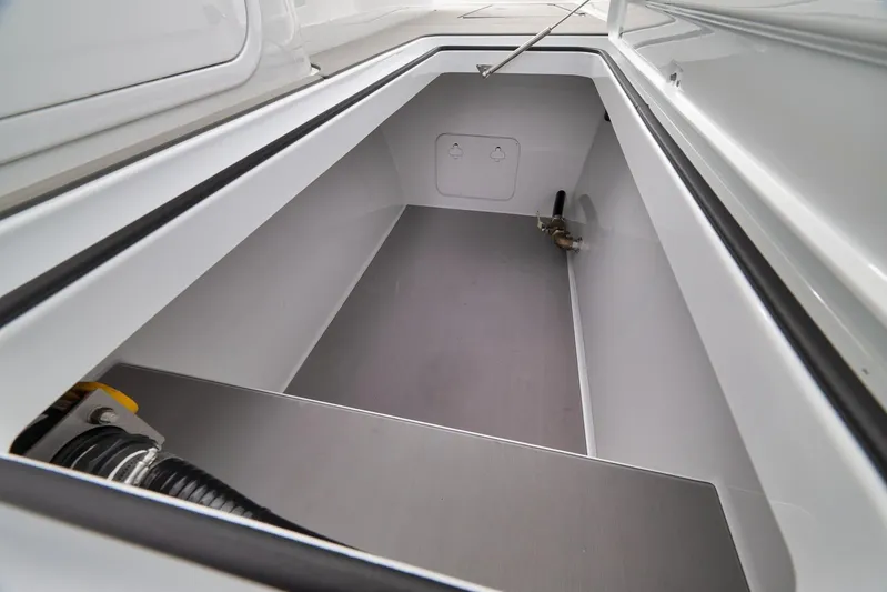  Yacht Photos Pics Open storage compartment in 2022 Freeman 42LR boat, showcasing clean interior design.