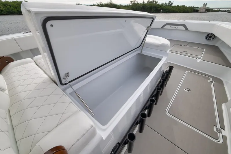  Yacht Photos Pics Freeman 42LR 2022 boat interior with open storage compartment and rod holders.