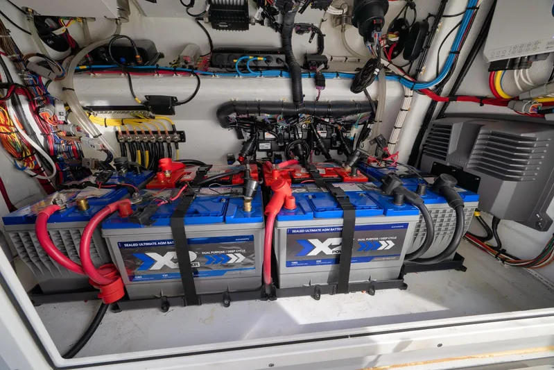  Yacht Photos Pics Battery compartment of a 2022 Freeman 42LR boat, featuring AGM batteries and wiring.