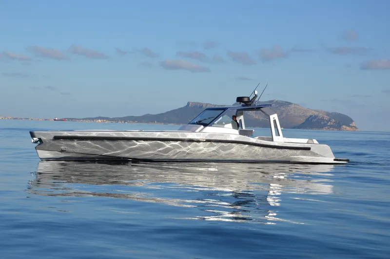  Yacht Photos Pics 2017 Maori 50 luxury yacht on calm waters with scenic island backdrop.