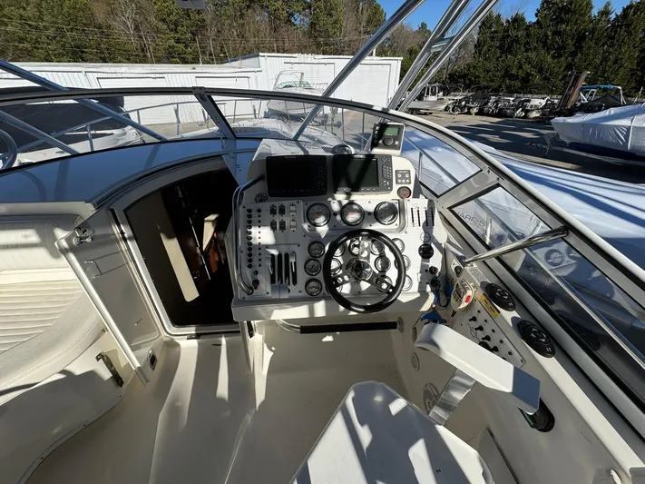  Yacht Photos Pics 2008 Fountain 38 Sportfish Express Cruiser helm with modern controls and navigation equipment.