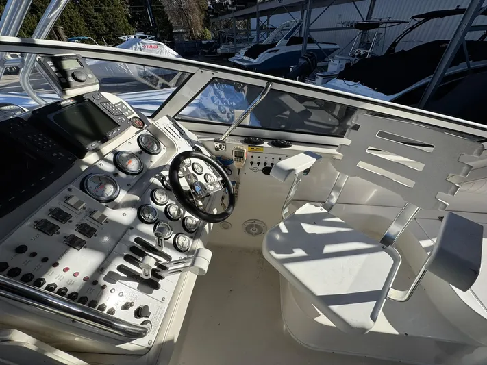  Yacht Photos Pics 2008 Fountain 38 Sportfish Express Cruiser cockpit with steering wheel and control panel.
