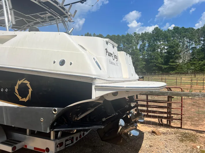  Yacht Photos Pics 2008 Fountain 38 Sportfish Express Cruiser docked outdoors, rear view, clear sky.