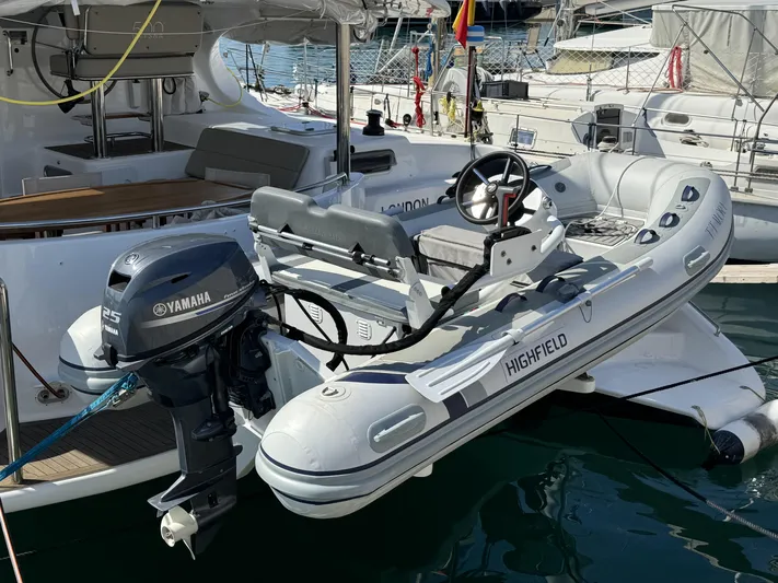 Alora Yacht Photos Pics 2023 Knysna 500 SE yacht with Highfield tender and Yamaha outboard motor docked at marina.