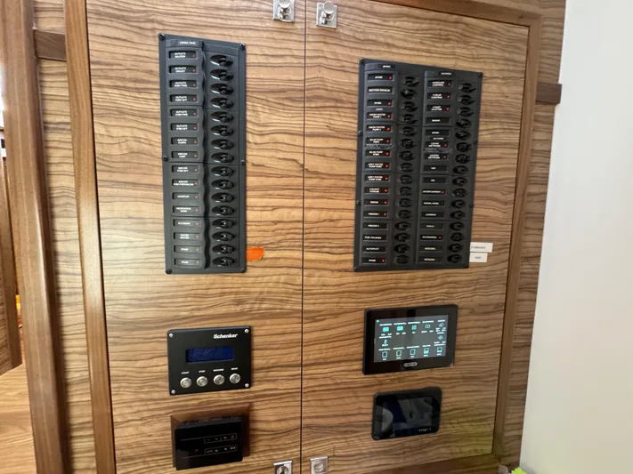 Alora Yacht Photos Pics Control panel of a 2023 Knysna 500 SE yacht with switches and digital displays.