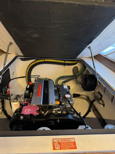 Alora Yacht Photos Pics Engine compartment of 2023 Knysna 500 SE, featuring a Yanmar engine with visible components.