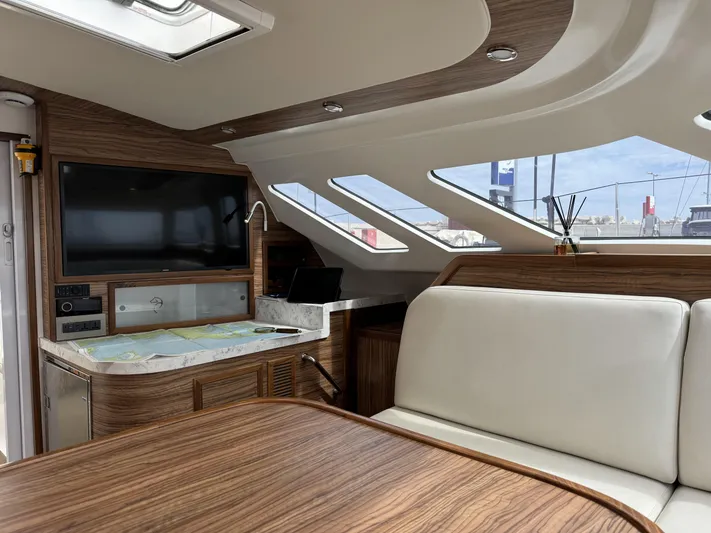 Alora Yacht Photos Pics Luxurious interior of 2023 Knysna 500 SE yacht with wood finish and modern amenities.