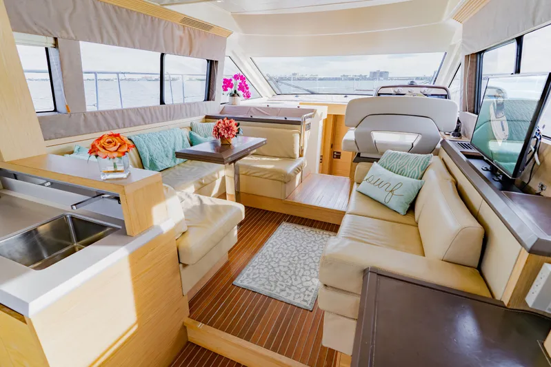 Nauti Obsession Yacht Photos Pics Luxurious interior of 2015 Monte Carlo MC5 yacht with elegant seating and decor.