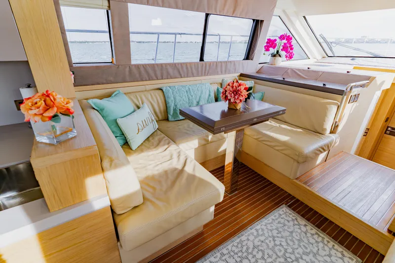 Nauti Obsession Yacht Photos Pics Luxurious Monte Carlo MC5 2015 yacht interior with elegant seating and floral decor.