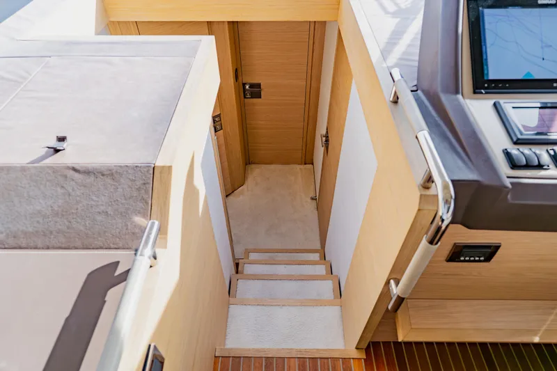 Nauti Obsession Yacht Photos Pics Staircase leading to cabin interior on 2015 Monte Carlo MC5 yacht.