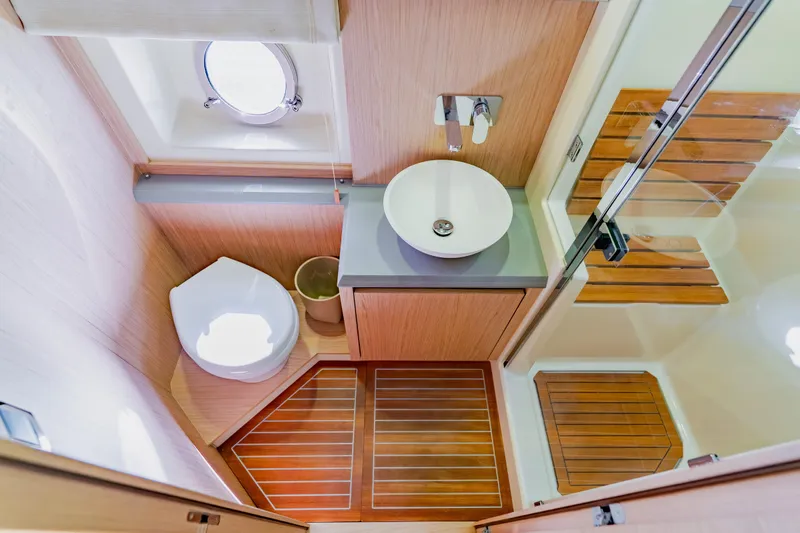 Nauti Obsession Yacht Photos Pics Luxurious bathroom in 2015 Monte Carlo MC5 yacht with modern fixtures and wooden accents.