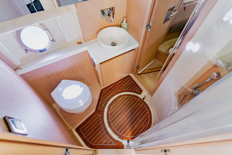 Nauti Obsession Yacht Photos Pics Luxurious 2015 Monte Carlo MC5 yacht bathroom with modern fixtures and wooden flooring.