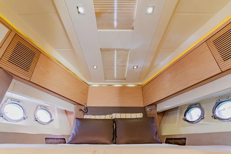 Nauti Obsession Yacht Photos Pics Luxurious interior of 2015 Monte Carlo MC5 yacht cabin with modern design elements.