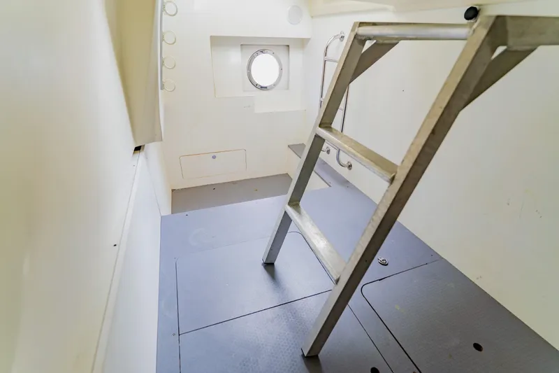 Nauti Obsession Yacht Photos Pics Interior of 2015 Monte Carlo MC5 yacht with ladder and porthole.