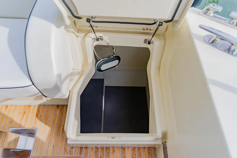 Nauti Obsession Yacht Photos Pics Open storage compartment on 2015 Monte Carlo MC5 boat deck.