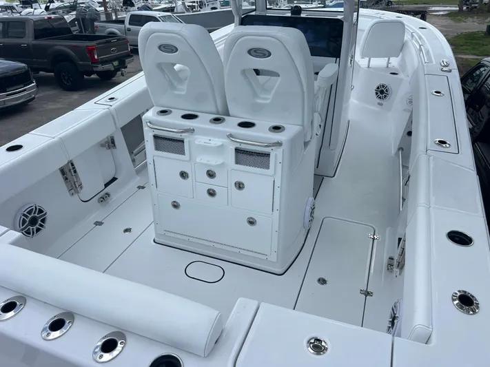  Yacht Photos Pics 2025 Sportsman Open 262 Center Console boat interior with seating and storage compartments.