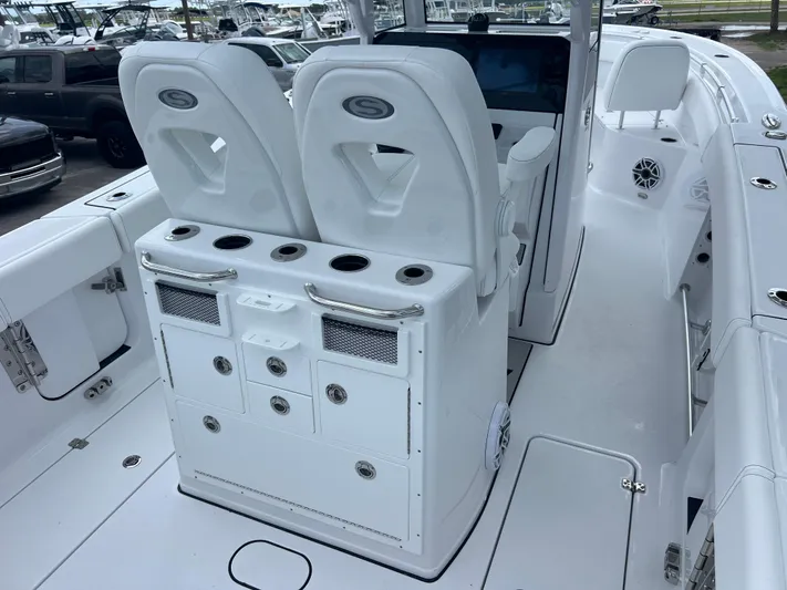  Yacht Photos Pics 2025 Sportsman Open 262 Center Console boat interior with dual seats and storage compartments.