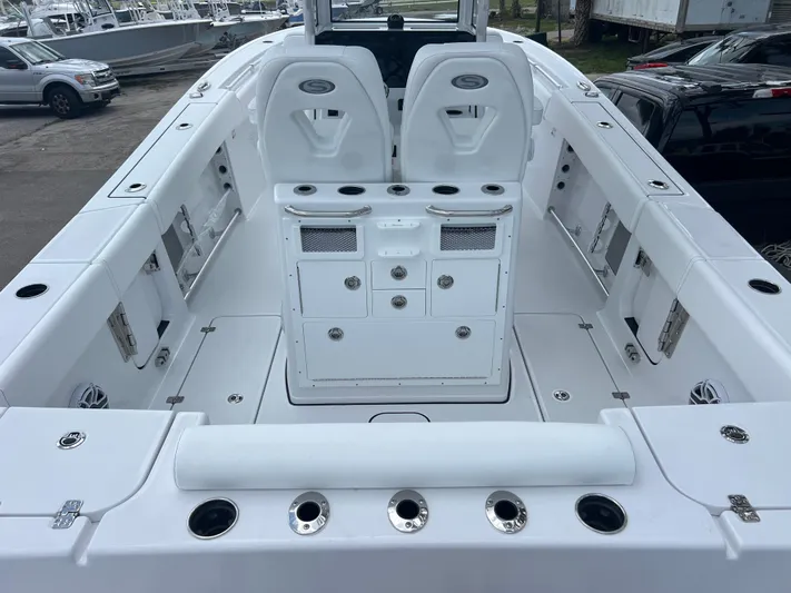  Yacht Photos Pics 2025 Sportsman Open 262 Center Console boat interior with seating and storage compartments.
