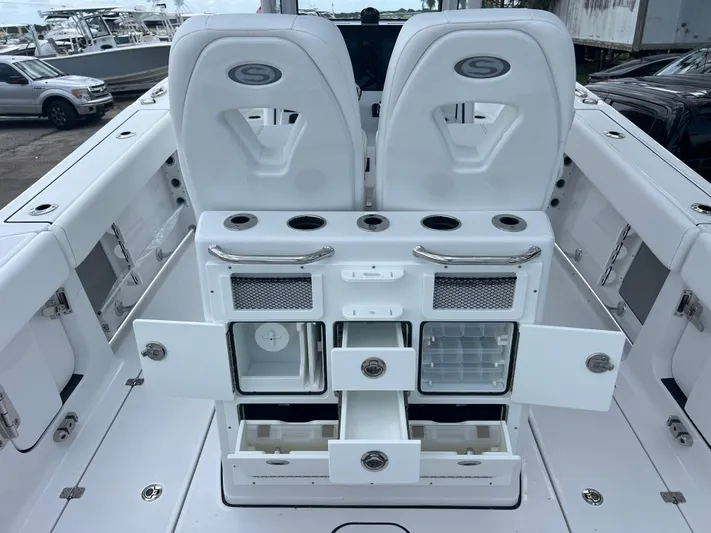  Yacht Photos Pics 2025 Sportsman Open 262 Center Console boat interior with storage compartments and seating.