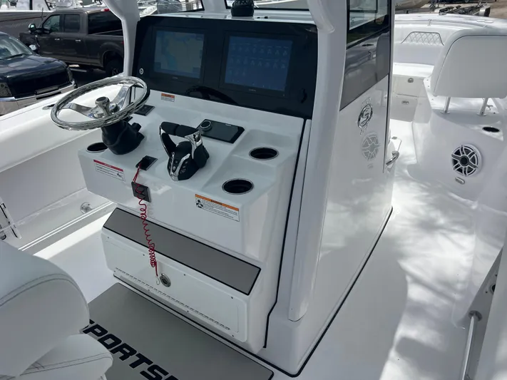  Yacht Photos Pics 2025 Sportsman Open 262 Center Console boat interior with steering wheel and control panel.