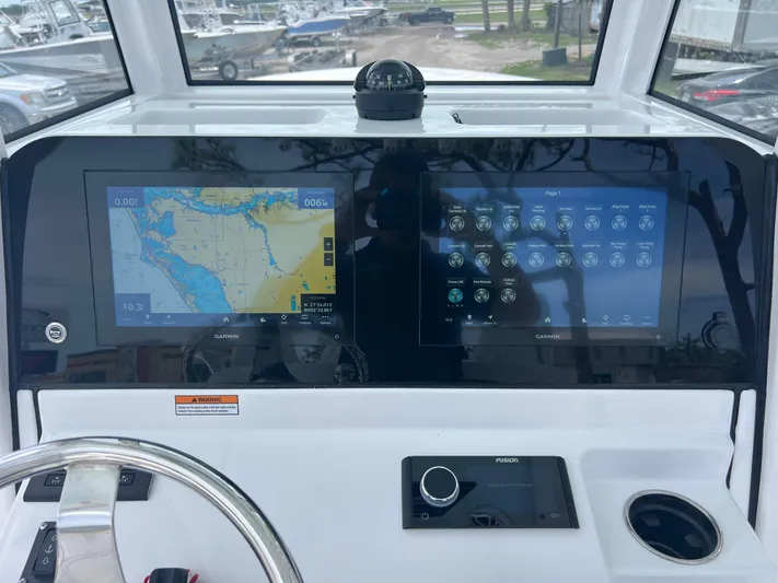  Yacht Photos Pics 2025 Sportsman Open 262 Center Console dashboard with dual Garmin displays and navigation controls.