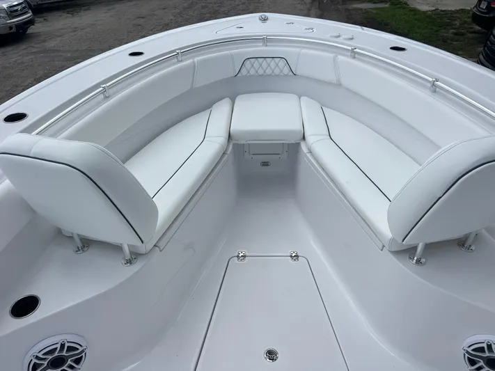  Yacht Photos Pics 2025 Sportsman Open 262 Center Console boat with white seating and stainless steel railings.