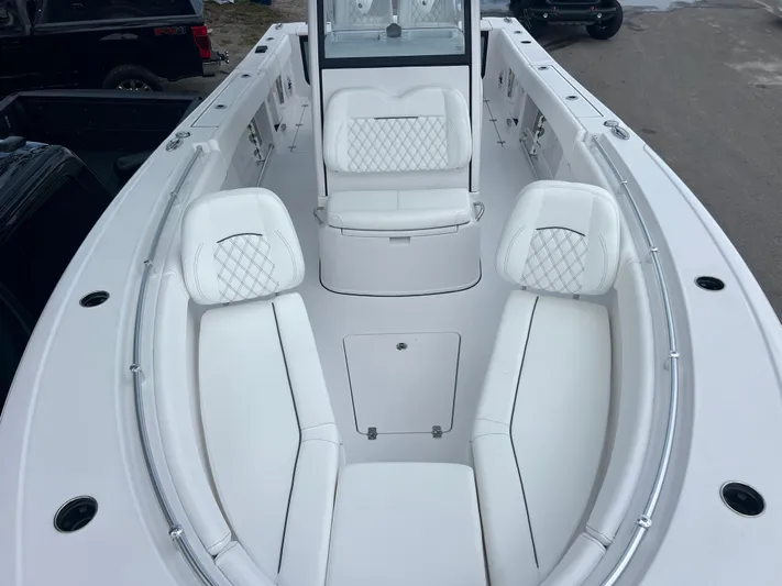  Yacht Photos Pics 2025 Sportsman Open 262 Center Console boat with white cushioned seating and sleek design.