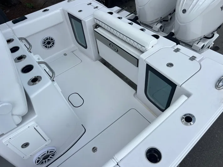  Yacht Photos Pics 2025 Sportsman Open 262 Center Console boat interior with seating and storage compartments.