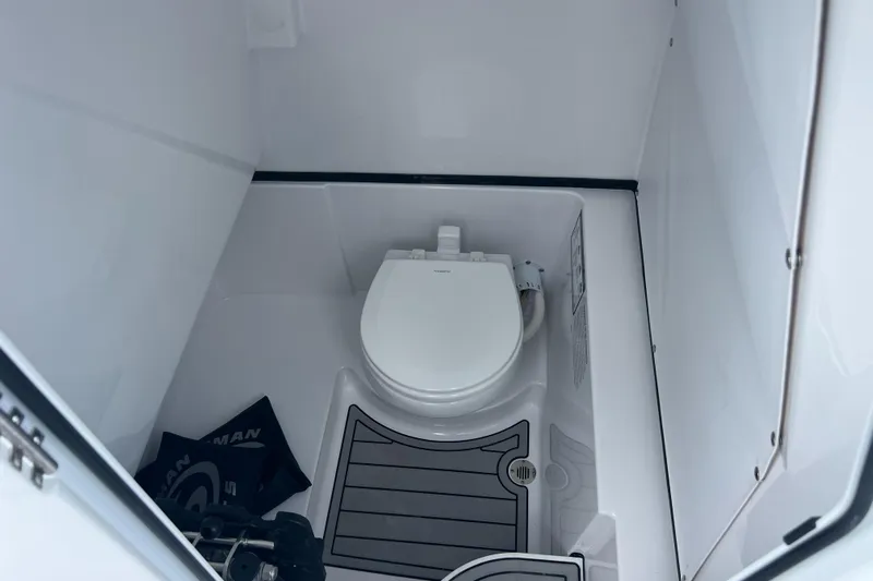  Yacht Photos Pics 2025 Sportsman Open 262 Center Console boat interior with toilet.