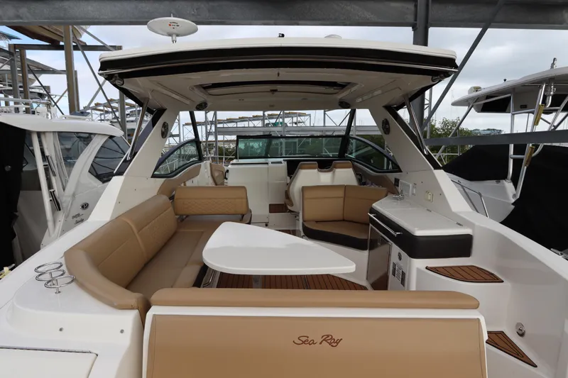  Yacht Photos Pics 2019 Sea Ray Sundancer 320 yacht interior with tan seating and modern amenities.