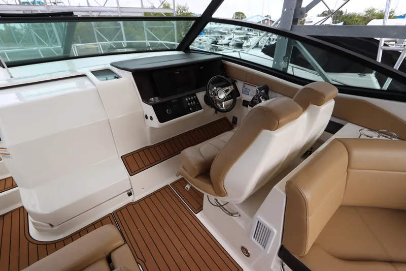  Yacht Photos Pics 2019 Sea Ray Sundancer 320 cockpit with modern helm, tan seating, and wood accents.