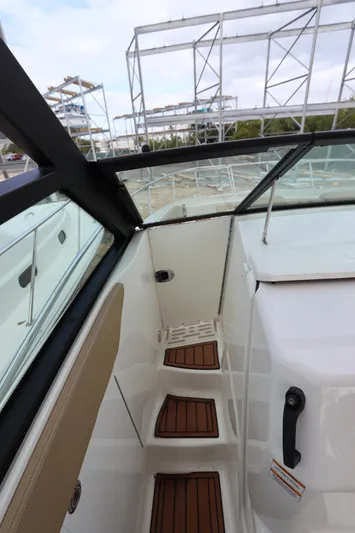  Yacht Photos Pics 2019 Sea Ray Sundancer 320 boat interior with wooden steps and glass panels.