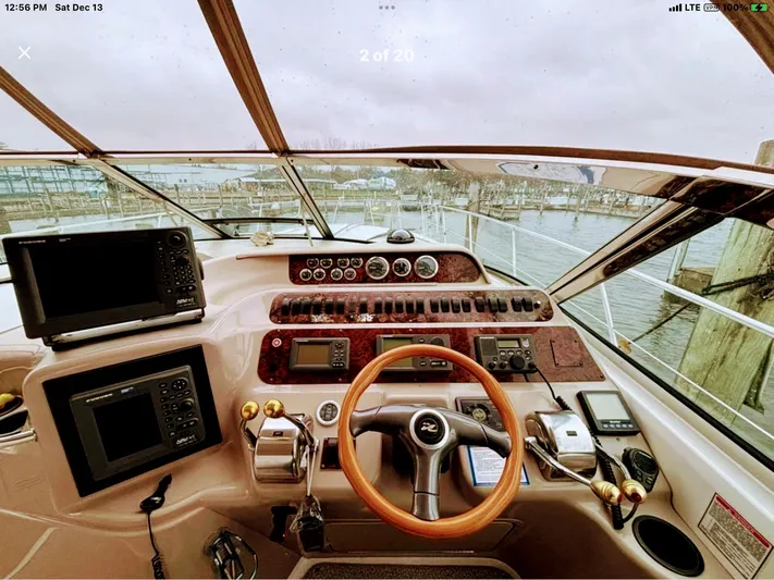 Lady Barb Yacht Photos Pics Cockpit of 1998 Sea Ray 400 Sundancer with steering wheel and instruments.