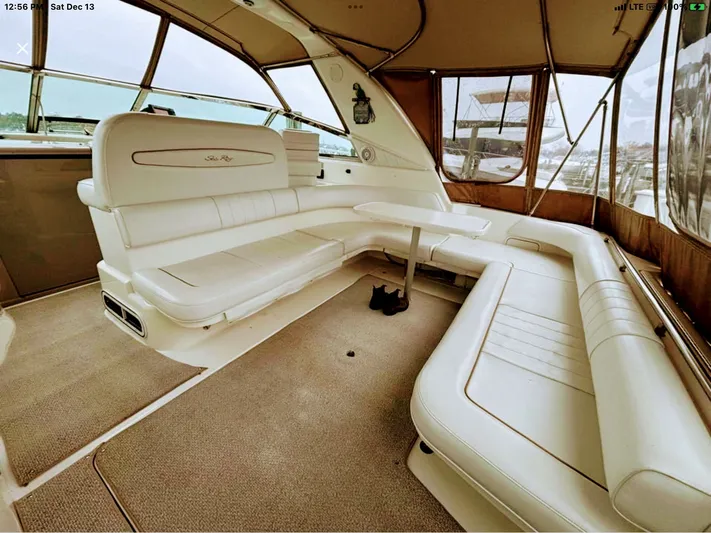 Lady Barb Yacht Photos Pics Interior of a 1998 Sea Ray 400 Sundancer yacht with beige upholstery.