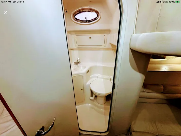 Lady Barb Yacht Photos Pics Interior of 1998 Sea Ray 400 Sundancer with bathroom.