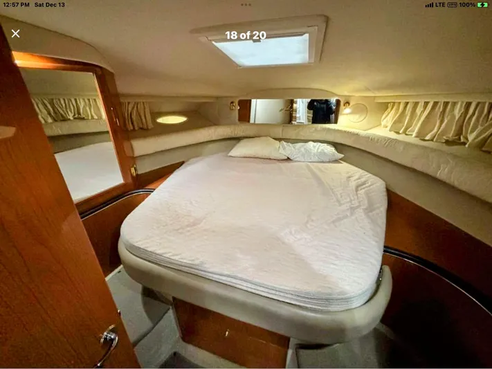 Lady Barb Yacht Photos Pics Interior of 1998 Sea Ray 400 Sundancer with cozy bed.