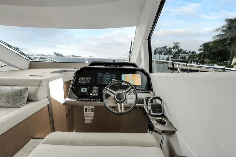 Yacht Photos Pics Helm of 2019 Galeon 500 Fly yacht with modern navigation equipment and waterfront view.