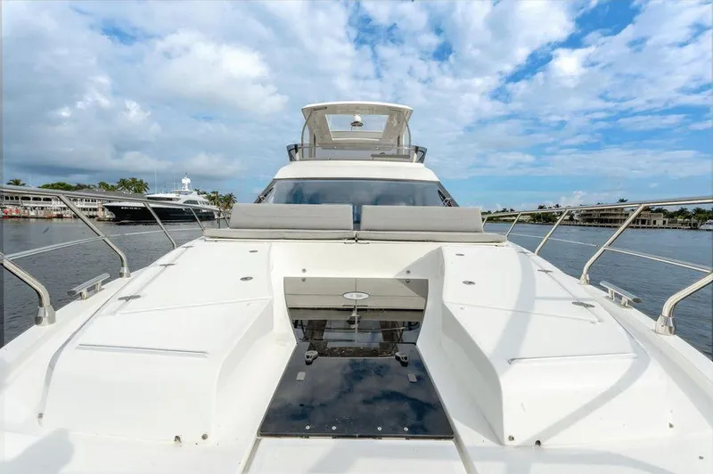  Yacht Photos Pics 2019 Galeon 500 Fly yacht on water, showcasing sleek design and spacious deck.