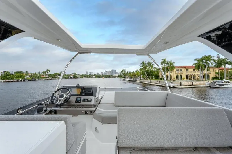  Yacht Photos Pics 2019 Galeon 500 Fly yacht interior with modern helm, cruising on a scenic waterway.